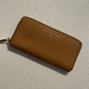Michael Kors large wallet in a brown/tanish color.